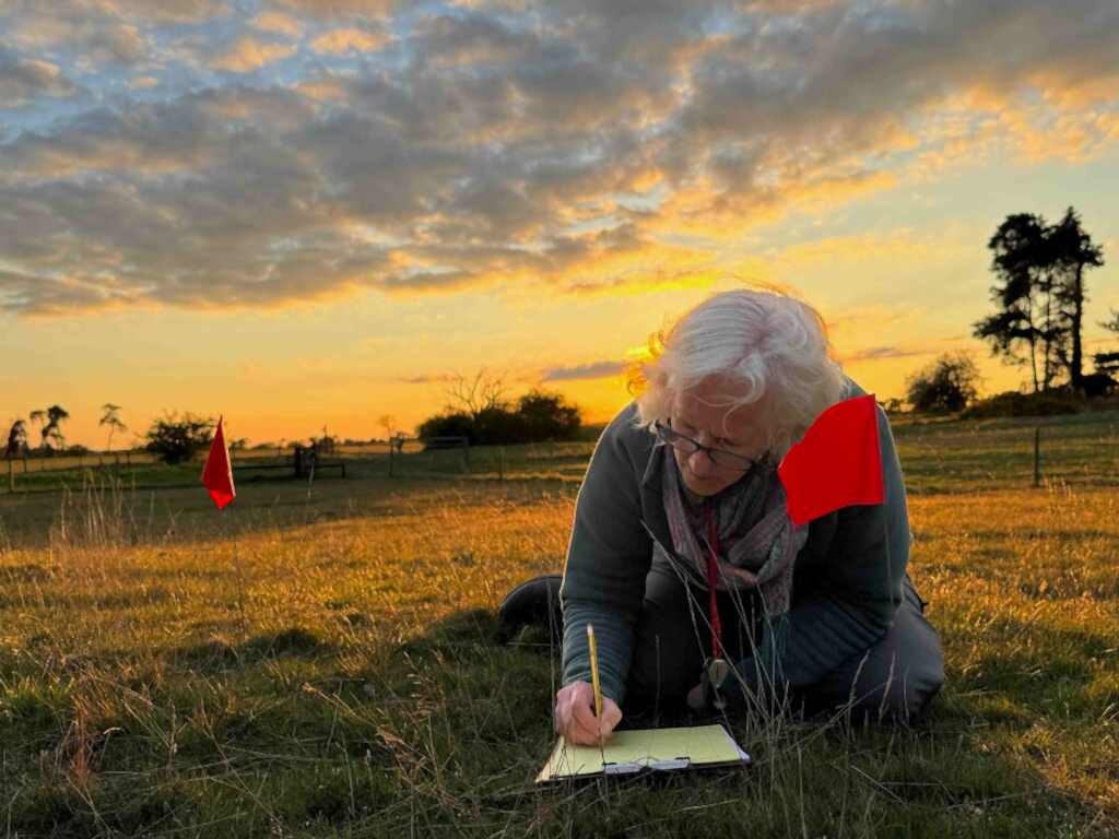 Woman recording plants